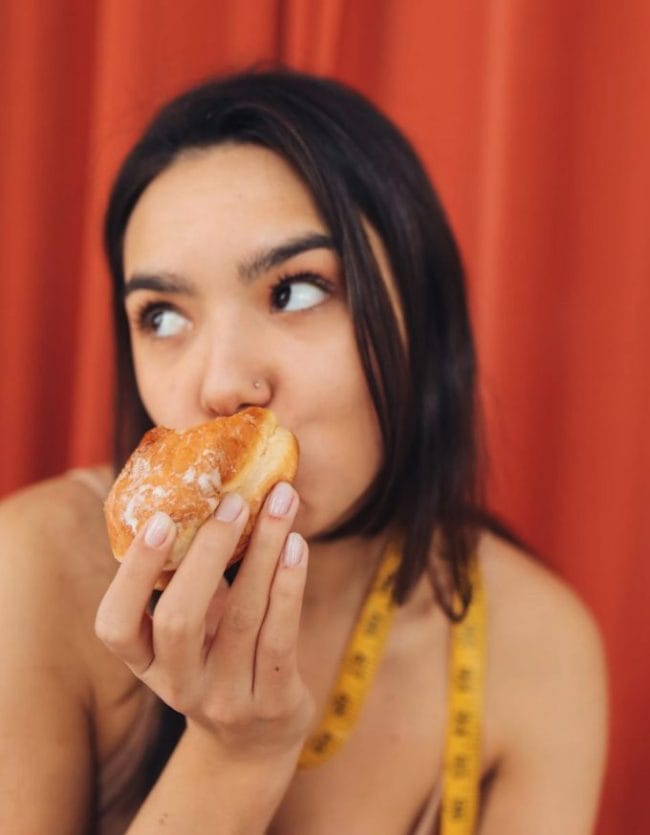 Woman Eating Donut
