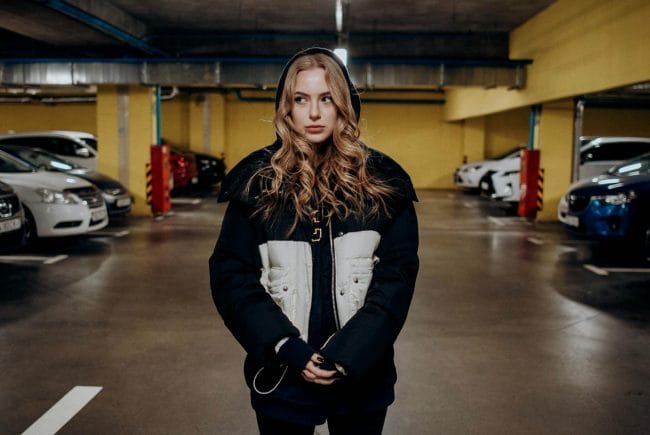 Woman In Parking Lot